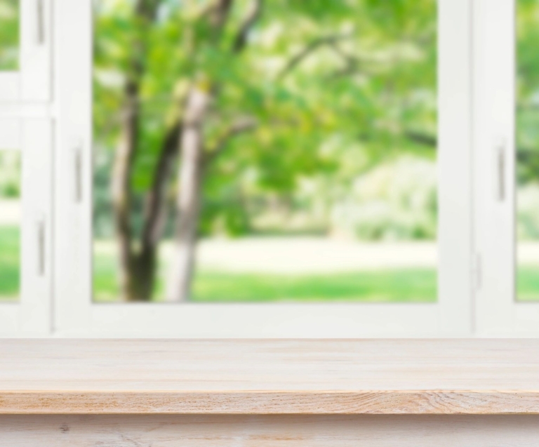 Window sill looking out to an outside yard